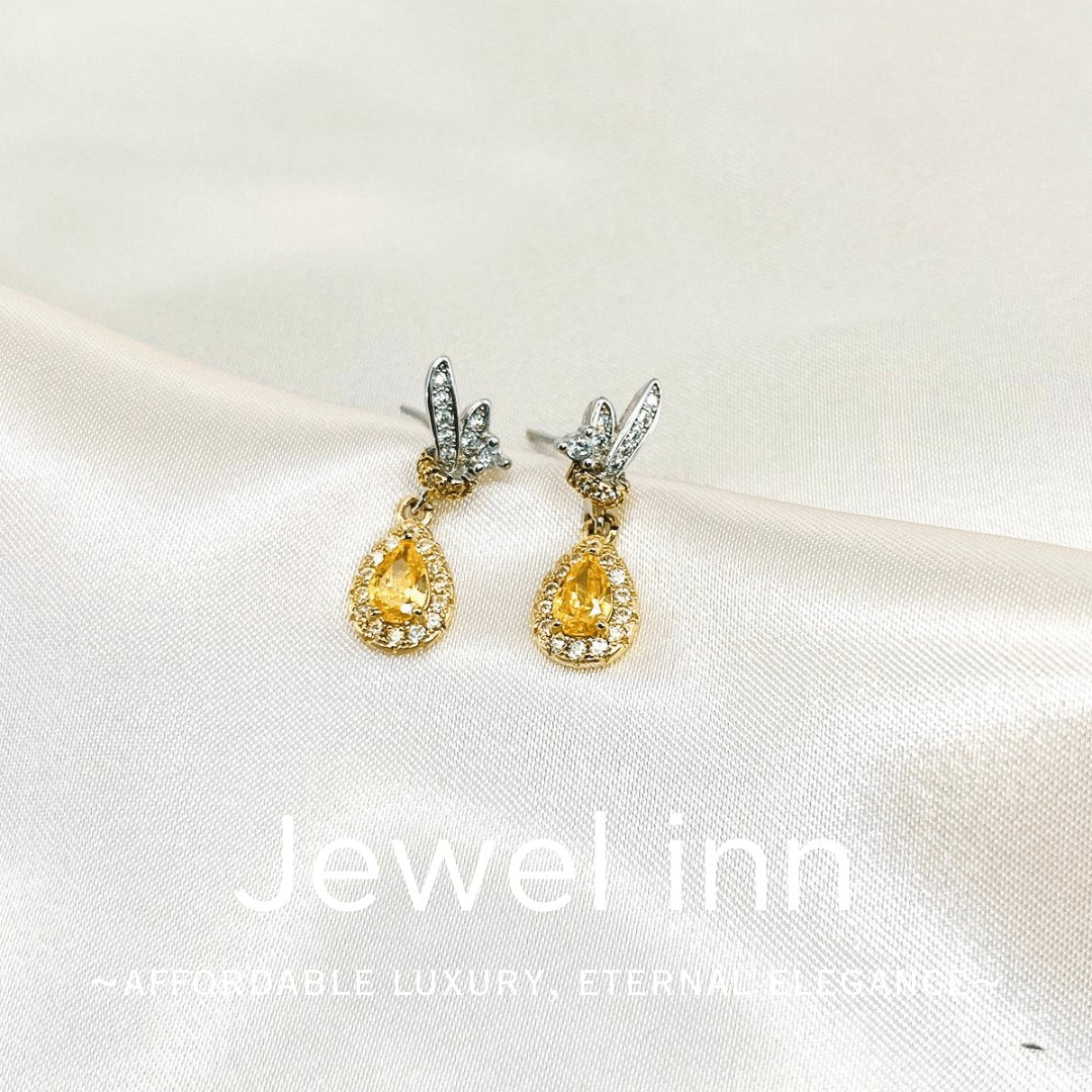 Golden Flutter Charms - Jewel Inn